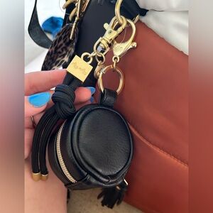 Itzy ritzy diaper bag charm pod black leather gold